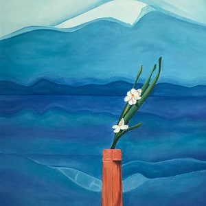 May include: A single white flower with green stems in a brown vase against a blue and white mountain landscape.