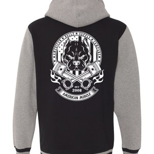 May include: Black and grey varsity jacket with a white logo on the back. The logo features a pit bull with crossed pistons and the text "American Bully Supply Company Est. 2008 American Muscle".