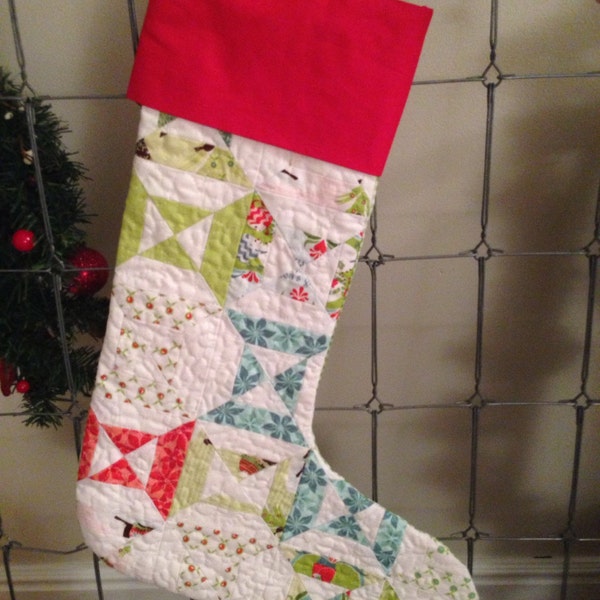 Quilted Christmas Stocking, #5 This stocking has a red top, green gingham backing, and a quilted hourglass front.