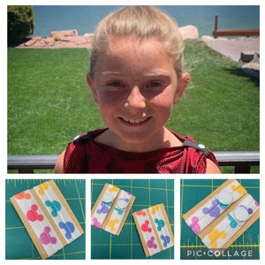 May include: A collage of images featuring a young person wearing a red top with black accents. The bottom images show white elastic bands with colorful Mickey Mouse head patterns, attached to cardboard. Each band has a white button.