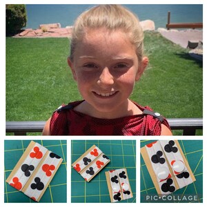 May include: A collage of images showing a person wearing a red top with black details. The lower images display elastic straps with a Mickey Mouse head pattern in red and black. The straps are attached to cardboard with white buttons.
