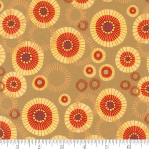 May include: A brown fabric with a repeating pattern of red, yellow, and white circles. The circles have a sunburst design with a smaller circle in the center.