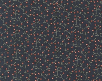 May include: Dark blue fabric with a repeating pattern of red berries and green vines. The fabric has a textured appearance and is suitable for quilting, sewing, or other craft projects. The design is reminiscent of a natural, botanical theme.