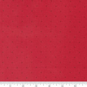 May include: Red fabric with a repeating pattern of small, dark brown dots. The fabric has a textured appearance and is suitable for various sewing and crafting projects. The dots are evenly spaced across the surface.