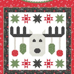 May include: A quilt pattern featuring a white reindeer with black antlers and red and green ornaments. The quilt is surrounded by a red and white border with black stars. The text "#206 Deerly Loved" is at the bottom of the quilt.