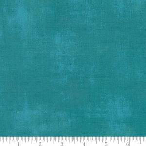 May include: A solid teal blue fabric with a subtle textured pattern. The fabric has a slightly distressed look, giving it a vintage feel.