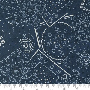 May include: Blue and white bandana print fabric with a patchwork design. The fabric features a variety of different bandana patterns, including paisley, stars, and diamonds.