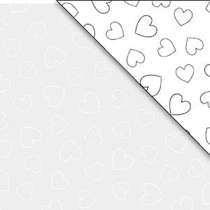 May include: Two-toned paper with a diagonal split. The left side is light gray with white heart outlines scattered across the surface. The right side is white with black heart outlines.