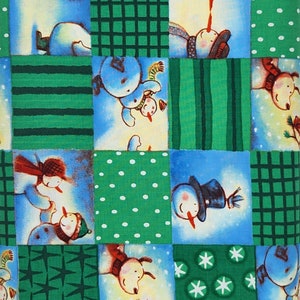 May include: A green and blue patchwork fabric with a repeating pattern of snowmen. The snowmen are wearing hats and scarves and are holding carrots. The fabric is perfect for quilting, crafts, and home decor.