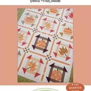 May include: A quilt pattern titled "Fall Dash" by Sherri McConnell. The quilt design features repeating squares with pumpkin and leaf motifs in orange, brown, and cream colors. The text "A Fat Quarter Quilt" is also visible.