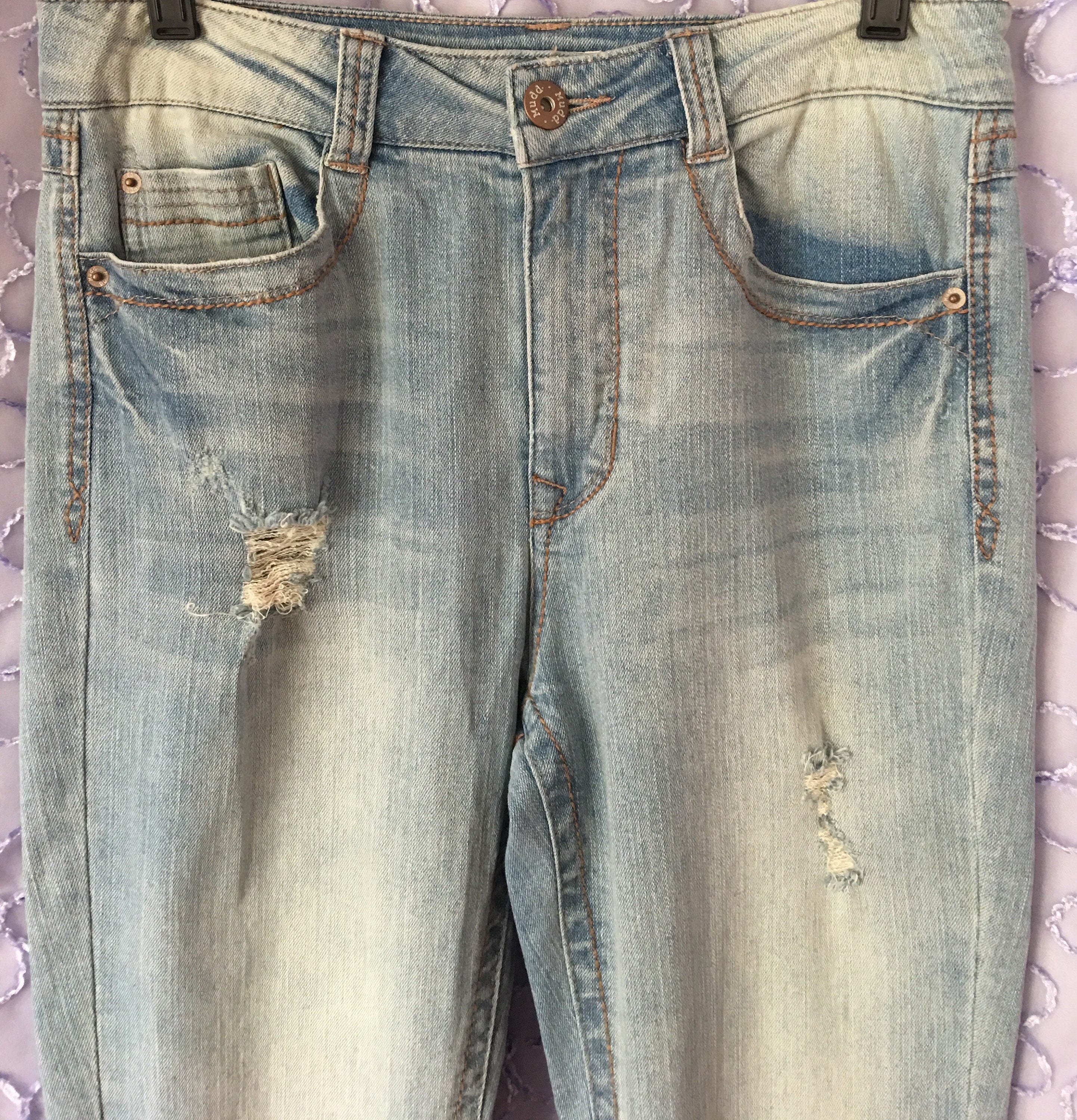 light wash distressed bell bottom jeans 