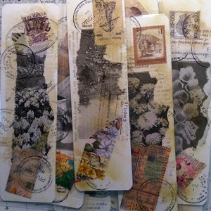 May include: A collection of handmade paper bookmarks with a vintage aesthetic. Each bookmark features collaged elements like postage stamps, floral patterns, and torn paper textures. The color palette includes beige, brown, and touches of color.