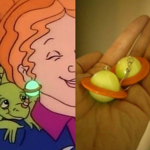 Get decked out like the fashionable Ms Frizzle with these glow in the dark Saturn earrings.
