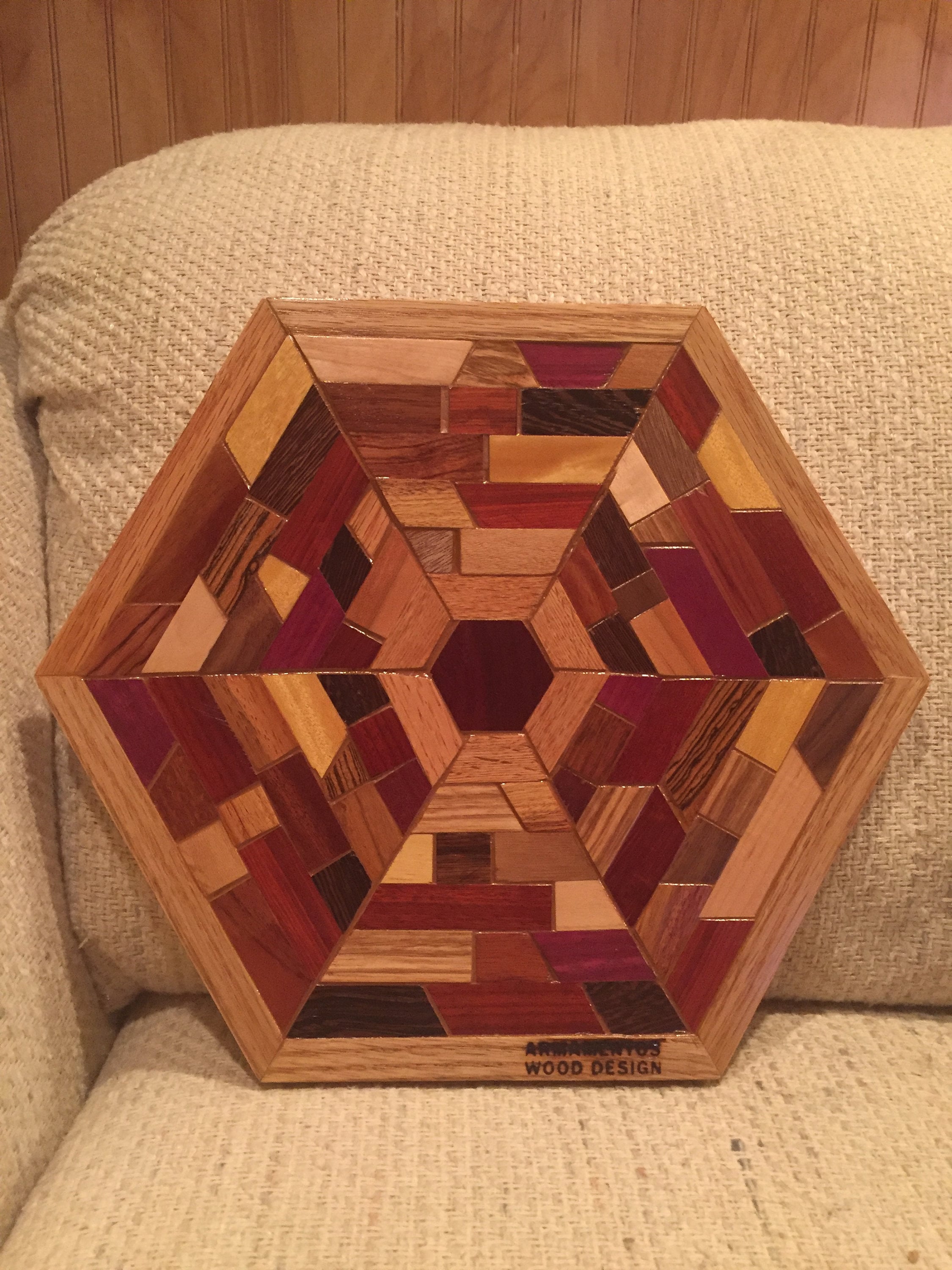 Hexagon Shaped Wood Wall Art Sculpture Featuring a Variety of 