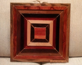 Wood wall art sculpture featuring a variety of exotic wood pieces in a geometric array.
