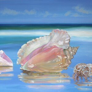 May include: Three seashells on a beach with blue water and a blue sky. The largest shell is pink and white, the second is white and pink, and the smallest is a hermit crab shell.