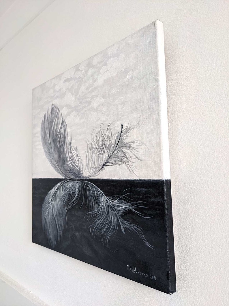 May include: A black and white painting of a feather on a black background with a white sky above. The feather is depicted in a realistic style with detailed brushstrokes. The artist's signature, "T.K. Dumenko 2011", is visible in the lower right corner.