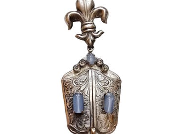 Antique Unusual Fleur-De-Lis Dangling Embossed Locket With Satin Glass Stones