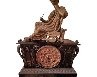 Black Iron Anstonia Mantle Clock With Gilt Face Gargoyle Handles And Lady Topper