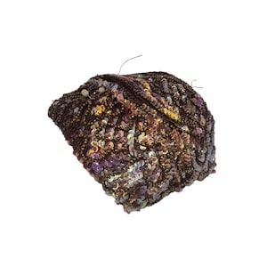 May include: A brown sequined fabric with gold and iridescent sequins.