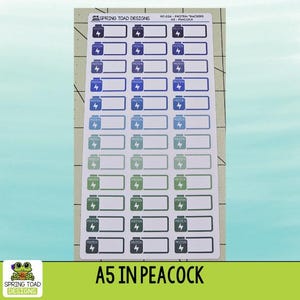 May include: A sheet of A5 stickers featuring protein tracker icons in a gradient of colors from dark purple to teal and dark gray. Each sticker displays a bottle icon with a lightning bolt and the word PROTEIN. The header reads SPRING TOAD DESIGNS.