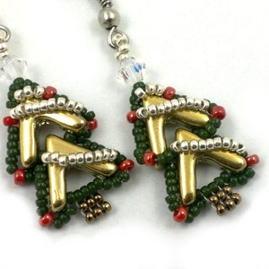 May include: A pair of gold and green Christmas tree earrings with red beads and silver accents.