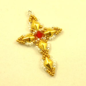 May include: A gold beaded cross pendant with a red crystal in the centre. The cross is made with small gold and white beads.
