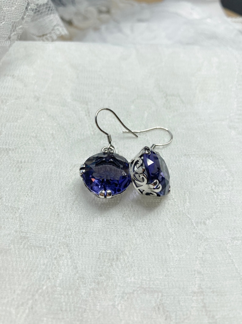 Solid 925 Sterling Silver Violet Purple February Simulated Birthstone Simulated Amethyst & Diamond Earrings 13mm x 7mm .01 cttw. Solid 925 Sterling Silver Violet Purple February Simulated Birthstone Simulated Amethyst & Diamond Earrings 13mm x 7mm .01 cttw.