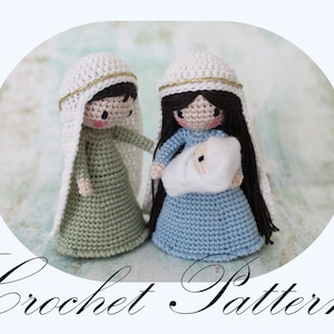 May include: Crochet pattern for a nativity scene with Mary, Joseph, and baby Jesus. Mary is wearing a blue dress and a white veil, Joseph is wearing a green robe, and baby Jesus is wrapped in white fabric.