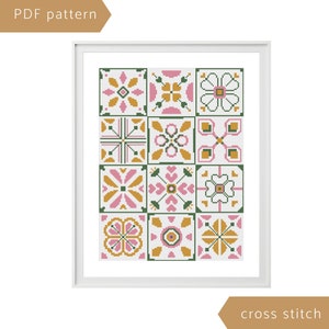 May include: Cross stitch pattern featuring a geometric design with pink, green, and yellow tiles. The pattern is framed in a white frame and labeled "PDF pattern" and "cross stitch".