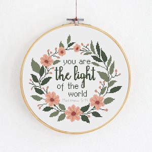 Modern biblical cross stitch pattern, You are the light of the world, Matthew 5:14, Floral border with flowers and leaves, Christian quote