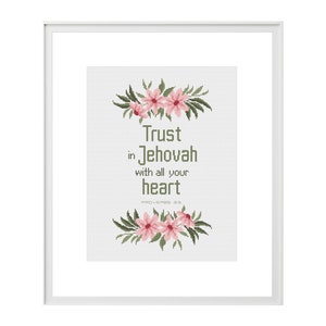 May include: Cross stitch pattern featuring a floral wreath with pink flowers and green leaves. The text reads "Trust in Jehovah with all your heart, Proverbs 3:5".