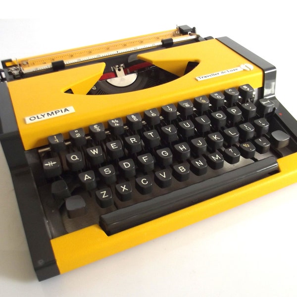vintage Olympia Traveller de Luxe typewriter, writing machine, case typewriter, yellow typewriter