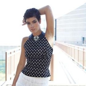 black and white dotted cotton 1950's style halter top with faux leather collar and flower pin image 1