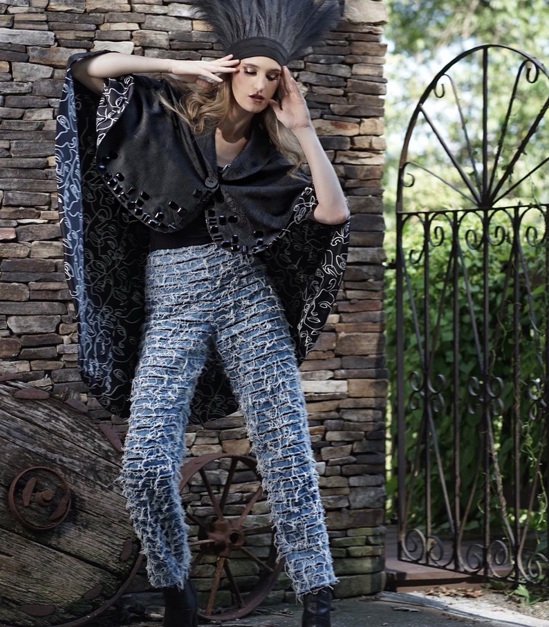 Denim jeans and pants with frayed strips attached to a black mesh. Flat front with back zipper and darts image 3