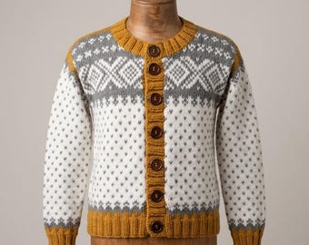 May include: A long-sleeve knit cardigan featuring a mustard yellow ribbed collar, cuffs, and hem. The body is white with a repeating gray speckled pattern and a gray and white geometric diamond design across the chest, secured by six brown buttons.