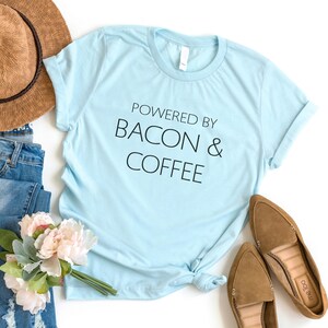 Powered by bacon & coffee gift women shirt with sayings graphic tee for womens teen clothes funny food gift for her funny tshirts Heather Ice Blue