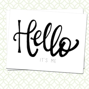 May include: A white card with black calligraphy that says "Hello, it's me".
