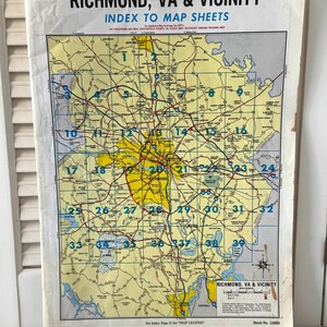 May include: Vintage map of Richmond, VA & Vicinity, featuring an index to map sheets. The map has a yellow and white color scheme with blue numbers and text. The map is slightly aged with some wear.