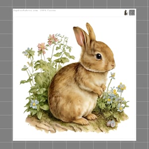 May include: A watercolor illustration of a brown rabbit sitting among green foliage and small pink and blue flowers. The image includes the text SaphiesFabrics.com 100% Cotton in the top left corner and a small cat icon in the top right corner.
