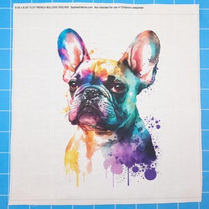 May include: A square fabric panel featuring a watercolor-style illustration of a French Bulldog with vibrant splashes of blue, purple, yellow, and orange. The text 8.00 x 8.00 E157 FRENCH BULLDOG DOG.PDF SaphiesFabrics.com Not intended for use in Children's sleepwear.