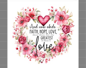 May include: A fabric panel featuring a heart-shaped wreath of pink and red flowers with green leaves. In the center, black text reads: And now abide FAITH, HOPE, LOVE, these three; but the GREATEST of these is love. A red heart above says 1 Corinthians 13:13.