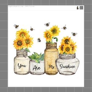 May include: A fabric panel featuring four glass jars with yellow sunflowers and flying bees. The jars are labeled with the text You Are My Sunshine in black script. The top margin includes the text SaphiesFabrics.com 100% Cotton and a small cat icon.