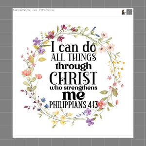 May include: White square fabric with a floral wreath design. The wreath surrounds the text "I can do ALL THINGS through CHRIST who strengthens me PHILIPPIANS 4:13". The wreath features pink, purple, and yellow flowers.