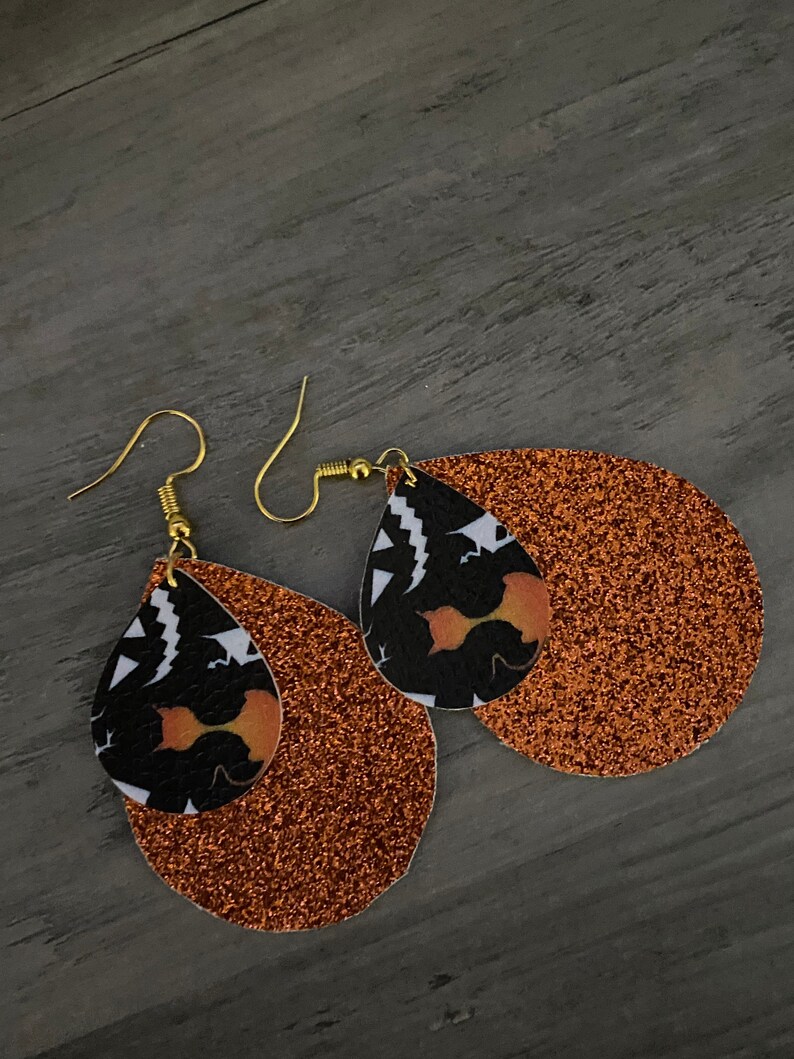 Handmade lightweight leather Halloween earrings with orange glitter