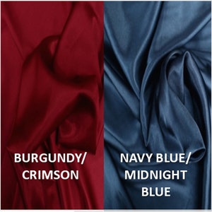 Op de afbeelding: Twee stofstalen, een in diep bordeauxrood en de andere in donkerblauw. Het bordeauxrode staal is geëtiketteerd met "Bordeaux/Krimzon" en het blauwe staal met "Marineblauw/Middernachtblauw".