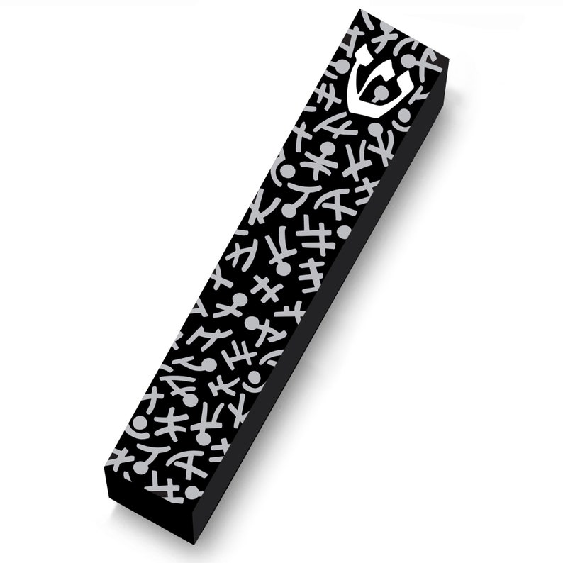 May include: A black mezuzah case with a white emblem and a pattern of white abstract shapes. The rectangular case is angled, showcasing its design and texture against a white background.
