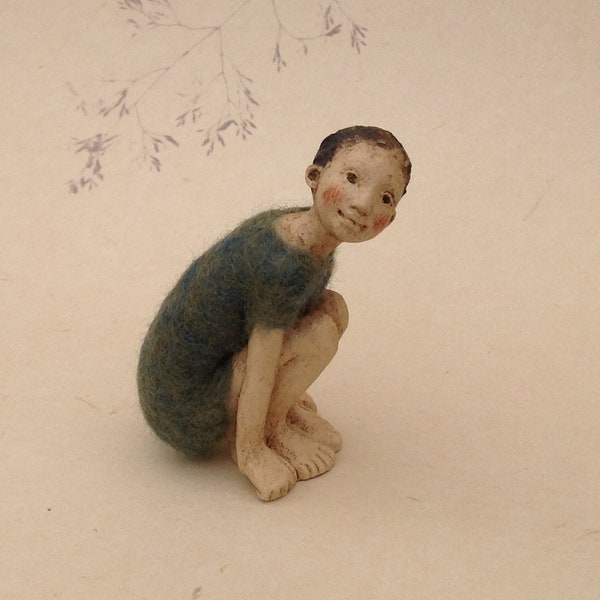 Tiny ceramic and felt crouching child, made to order..