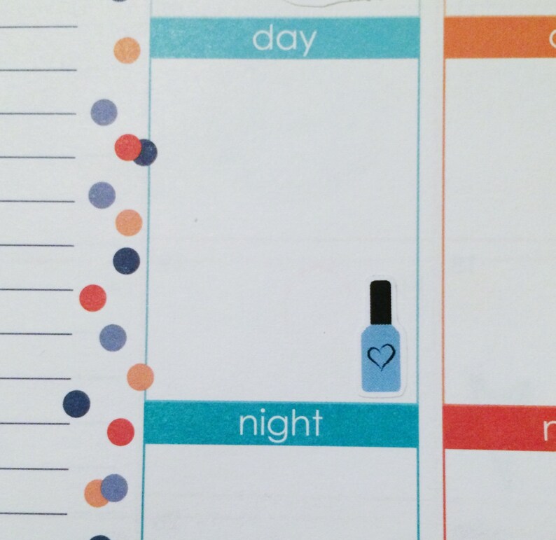 May include: A blue nail polish bottle with a white heart on the label. The bottle is on a white background with the words "day" and "night" written in blue.
