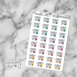 Könnte beinhalten: Ein Blatt mit bunten Aufklebern mit dem Text "Laundry Day" und einem Waschmaschinen-Symbol. Die Aufkleber sind in einem Raster angeordnet und eignen sich perfekt für Planer und Journale.